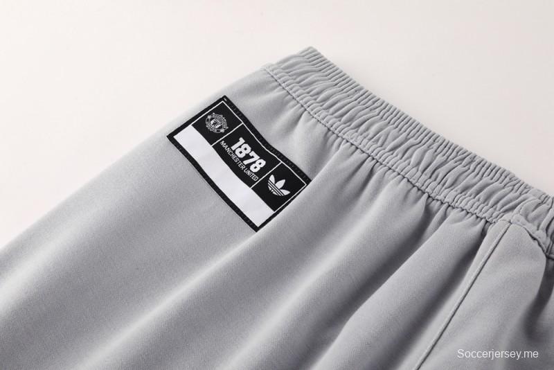 25/26 مانشستر يونايتد هويد جاكيت بسحاب كامل رمادي اللون هويد 25/26 مانشستر يونايتد + بنطلون طويل