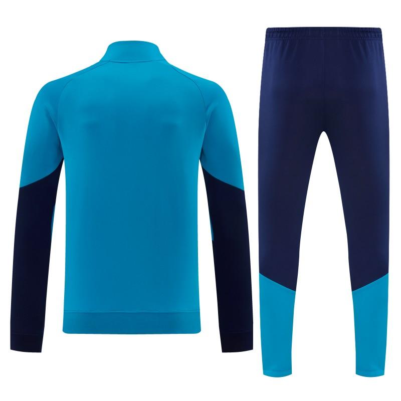 26/27 إسبانيا - طقم رياضي باللون الأزرق الفاتح مع سترة بسحاب كامل + بنطال طويل