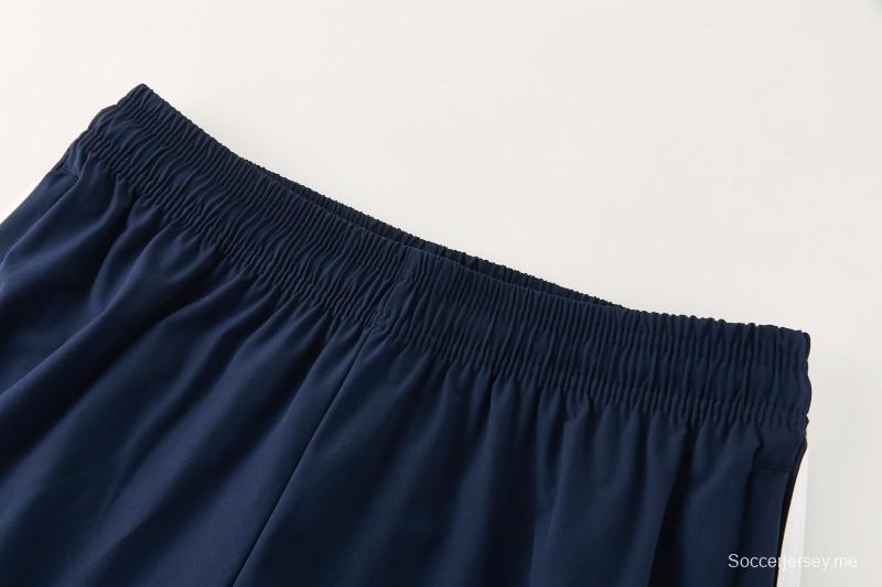 26/27 بدلة رياضية من ريال مدريد باللون الأزرق الداكن مع سترة واقية من الرياح بغطاء للرأس وسحاب كامل + بنطال طويل