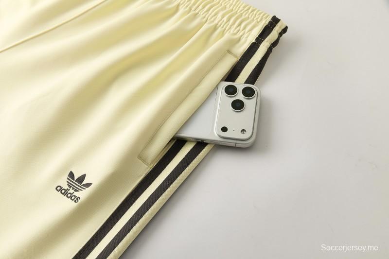 2026  سترة بأزرار كاملة + بنطال طويل من Adidas بلون المشمش