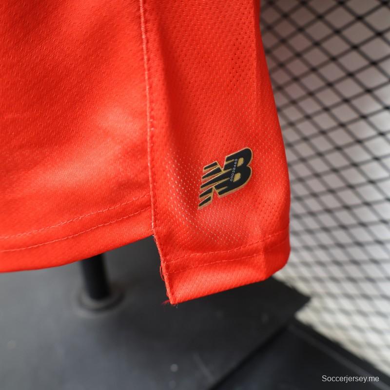 قميص ديارو لفريق ديبورتيفو تولوكا لكرة القدم، إصدار اللاعبين 26/27، باللون الأحمر مع نقشة خطوط دائرية